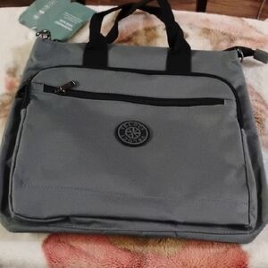 Gray  Crossbody Tote Bag with Front Zip and Multiple Pockets.
